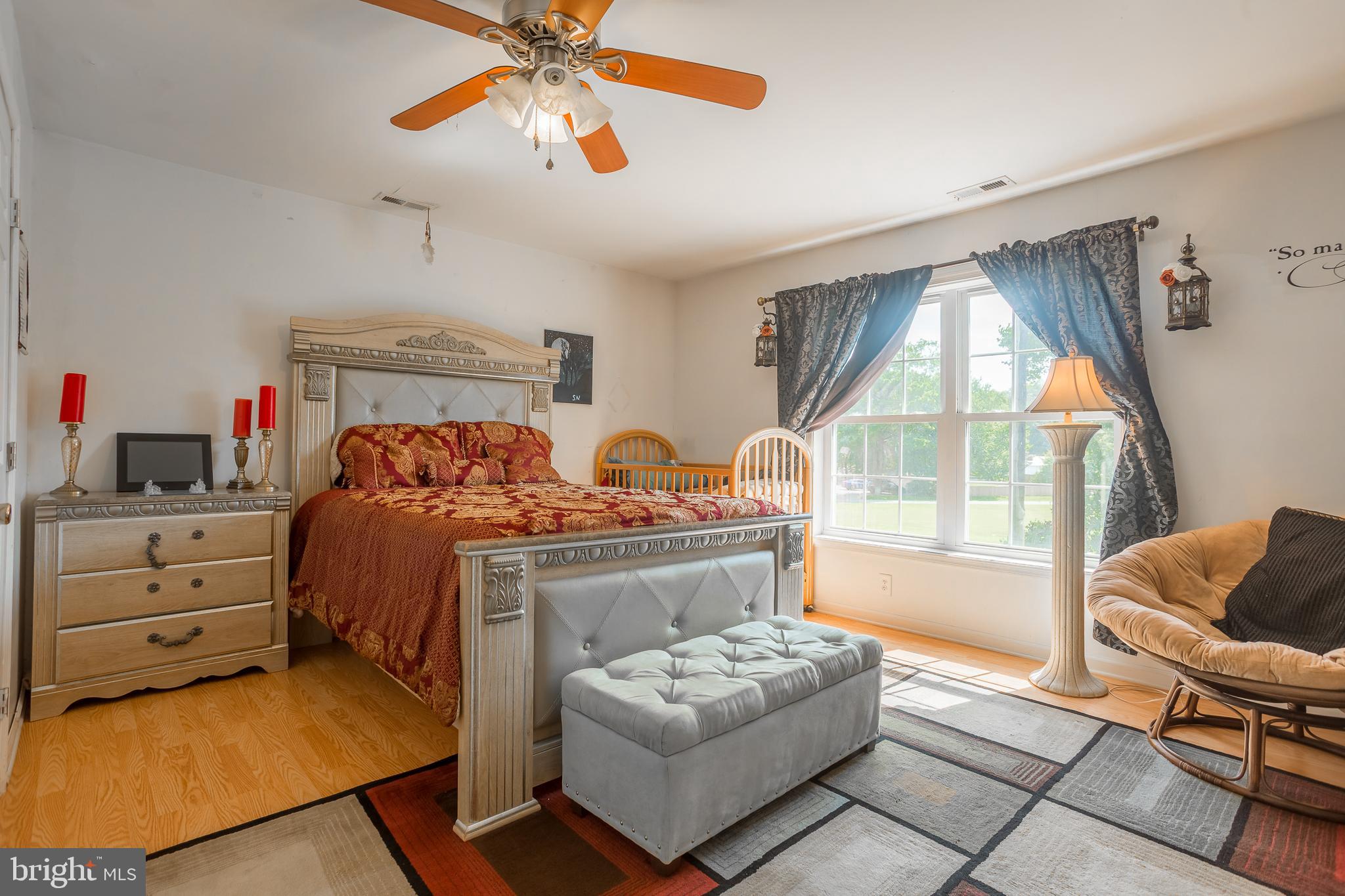 6629 Bowden Road Newark, MD 21841 - Photo 61 of 63 a bedroom with a bed and wooden floor