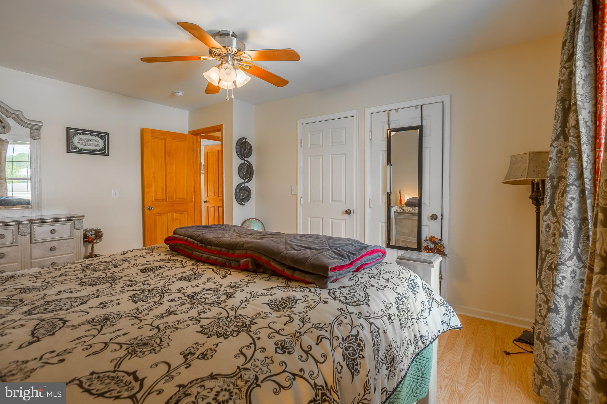 6629 Bowden Road Newark, MD 21841 - Photo 63 of 63 a bedroom with a bed and a chandelier