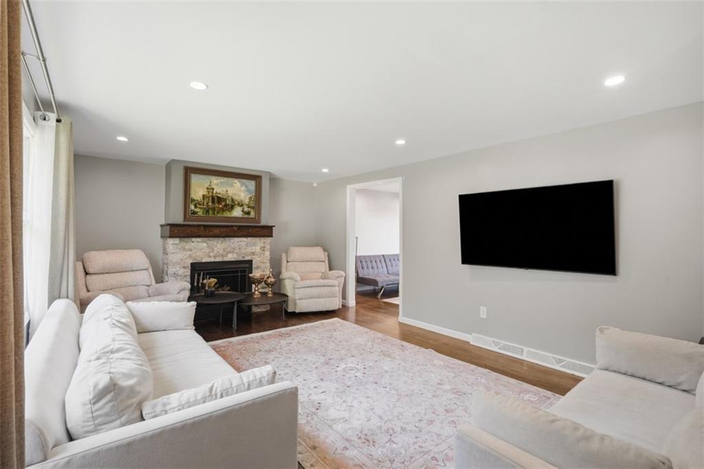 3941 Drexel Road Pittsburgh, PA 15212 - Photo 8 of 49 Spacious, clean living room featuring neutral-colored walls and gleaming hardwood floors.