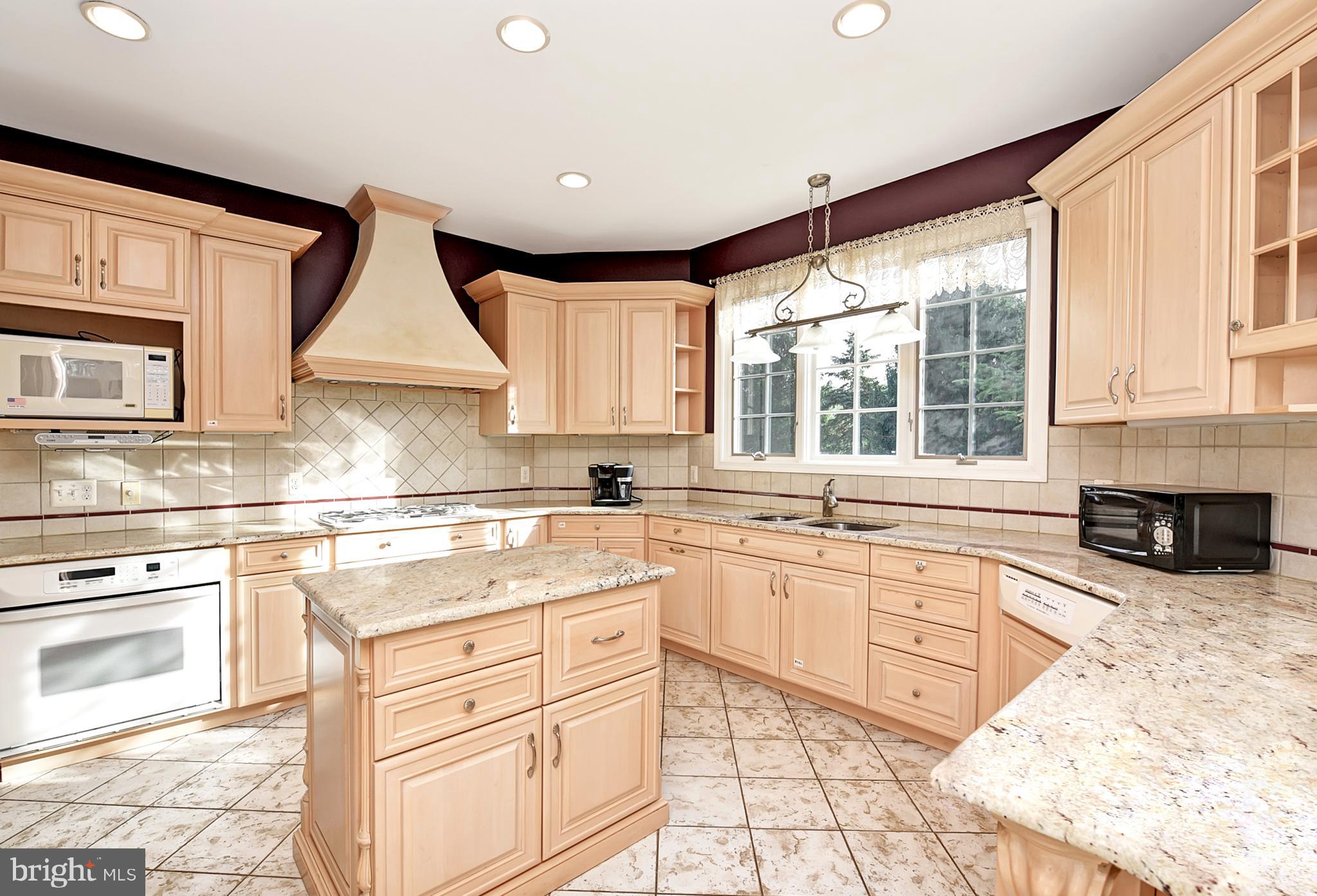 3919 Crosswicks Hamilton Square Road Trenton, NJ 08620 - Photo 12 of 61 a kitchen with stainless steel appliances a stove sink and cabinets