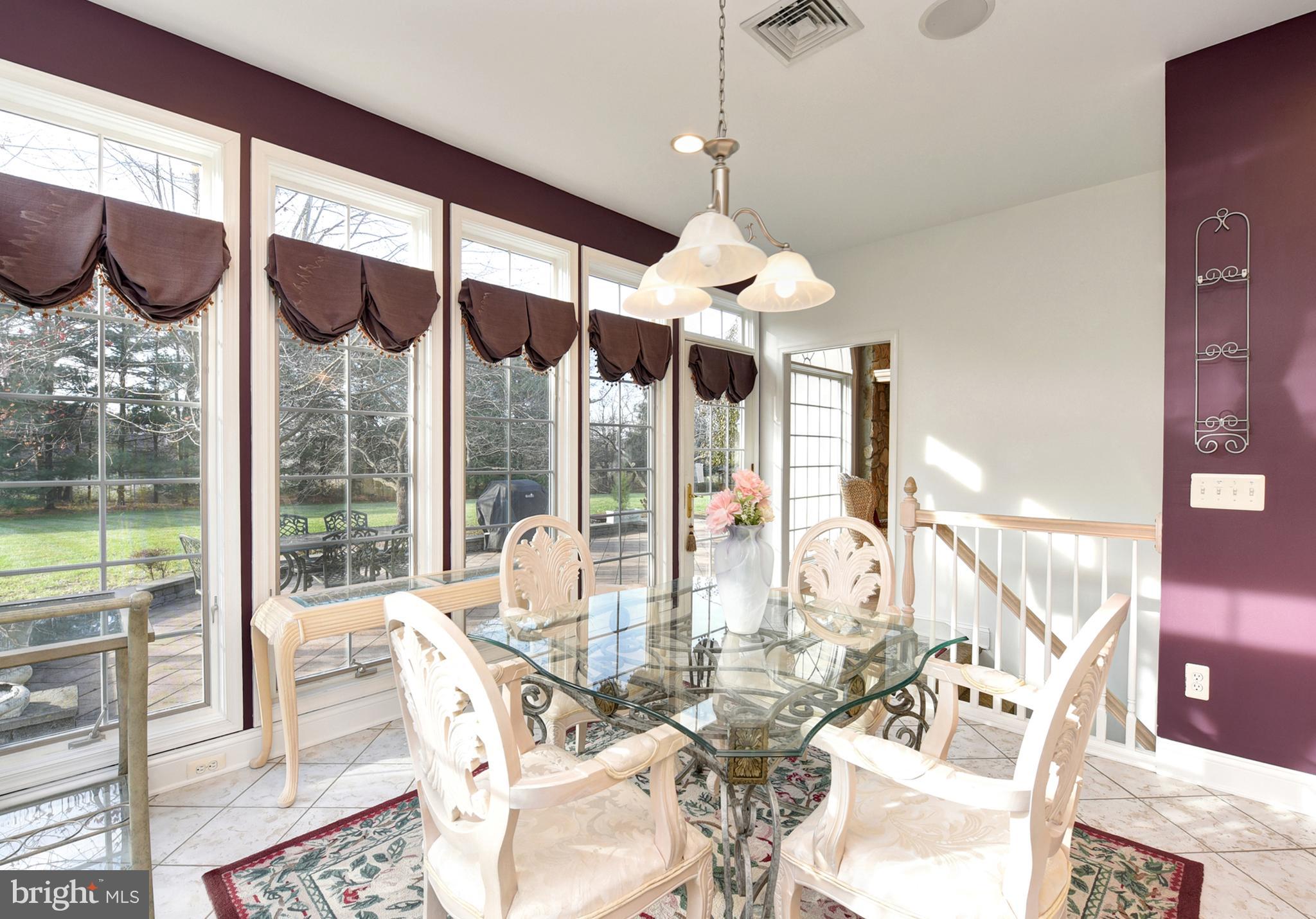 3919 Crosswicks Hamilton Square Road Trenton, NJ 08620 - Photo 15 of 61 a view of a dining room with furniture water view and floor to ceiling windows