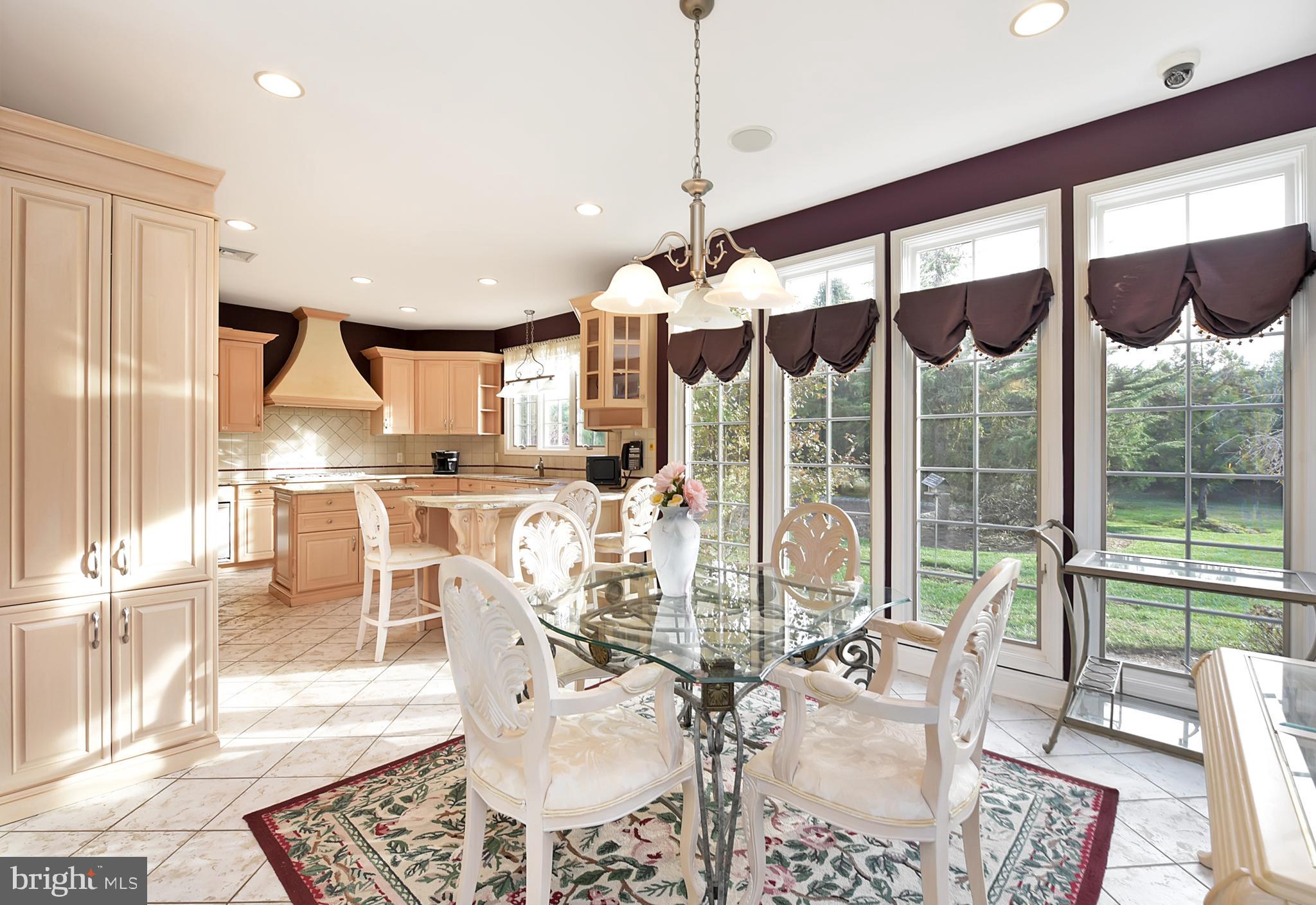 3919 Crosswicks Hamilton Square Road Trenton, NJ 08620 - Photo 16 of 61 a view of a dining room with furniture wooden floor and a chandelier