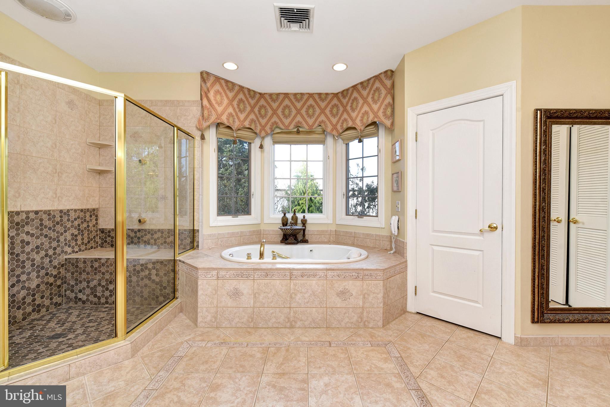 3919 Crosswicks Hamilton Square Road Trenton, NJ 08620 - Photo 27 of 61 a spacious bathroom with a tub shower and a sink