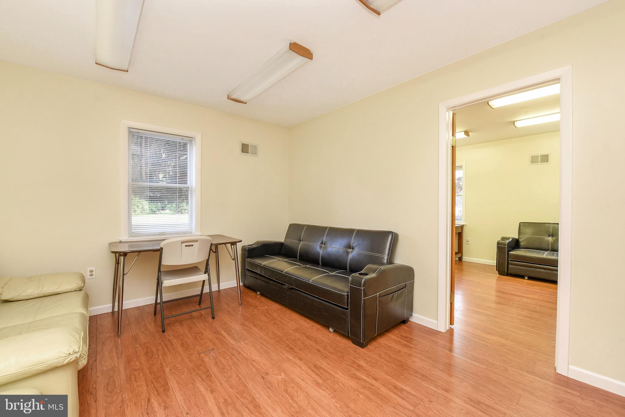 3919 Crosswicks Hamilton Square Road Trenton, NJ 08620 - Photo 38 of 61 a living room with furniture and a wooden floor
