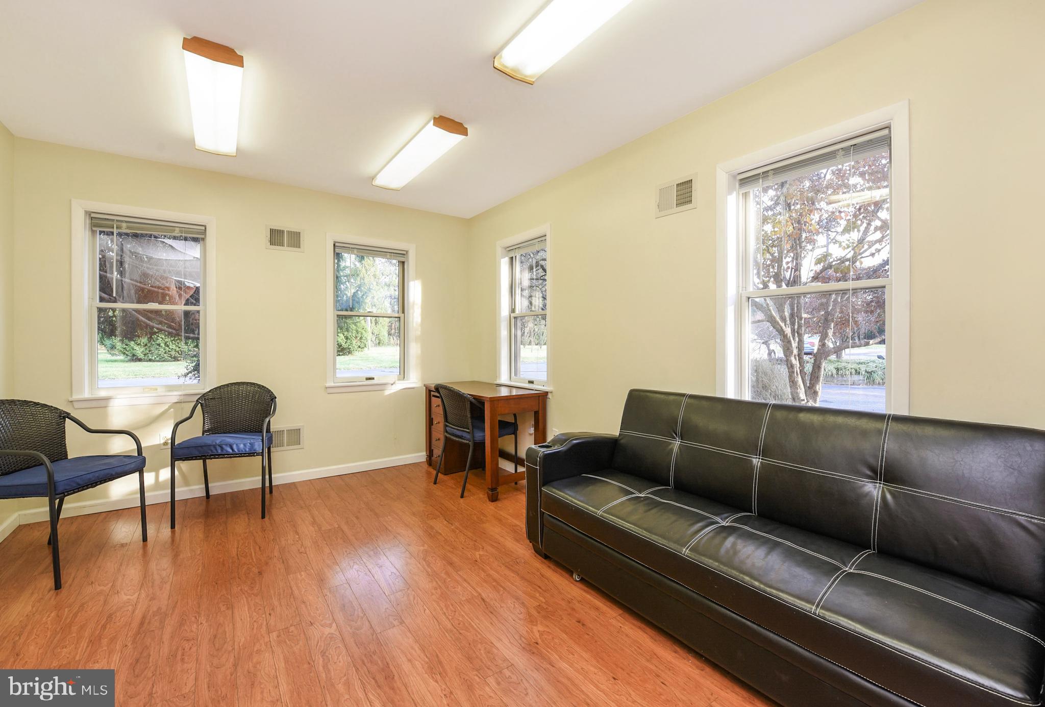 3919 Crosswicks Hamilton Square Road Trenton, NJ 08620 - Photo 39 of 61 a living room with furniture and a wooden floor