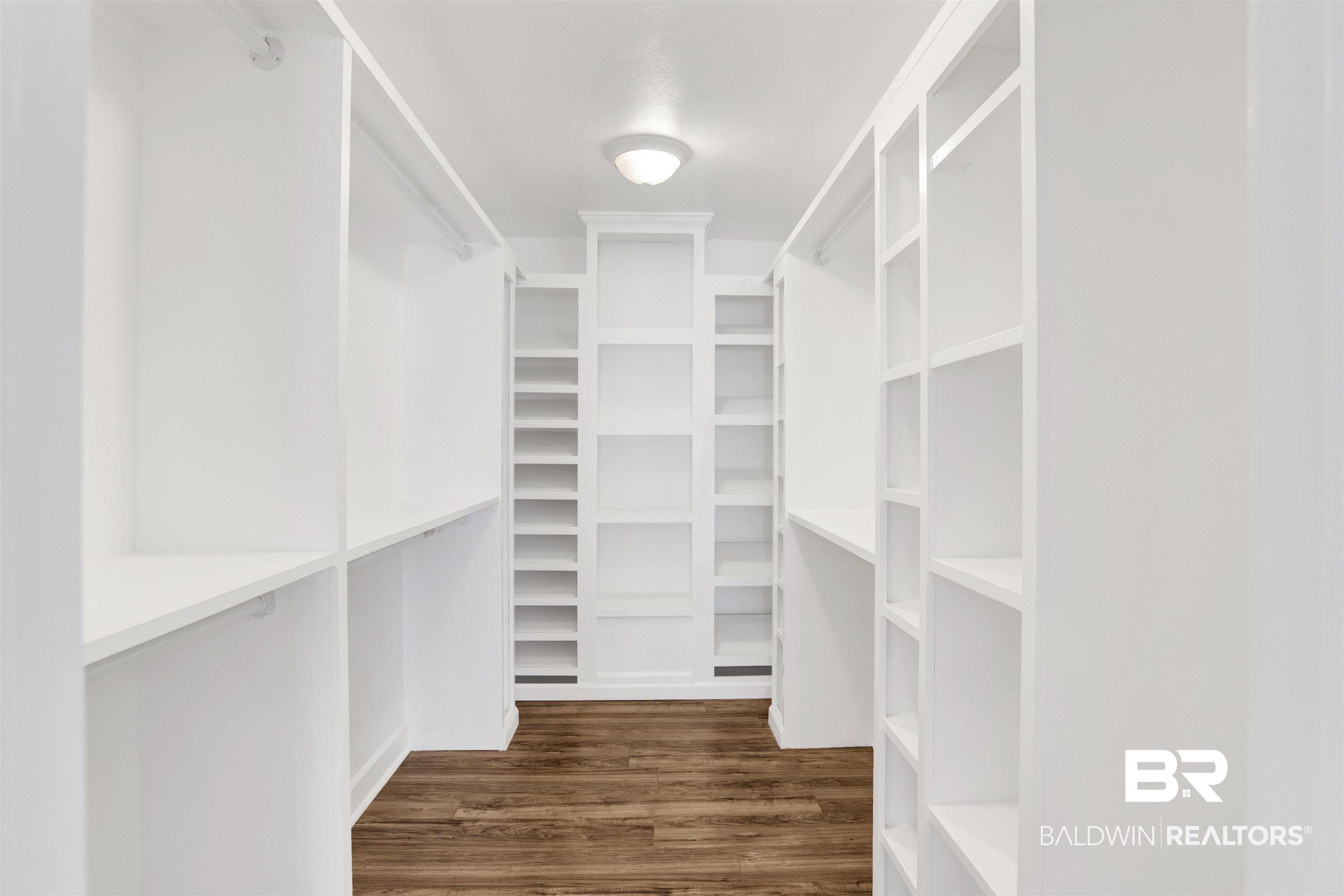 11835 Island Drive Foley, AL 36535 - Photo 13 of 53 Walk in closet with dark wood-style flooring