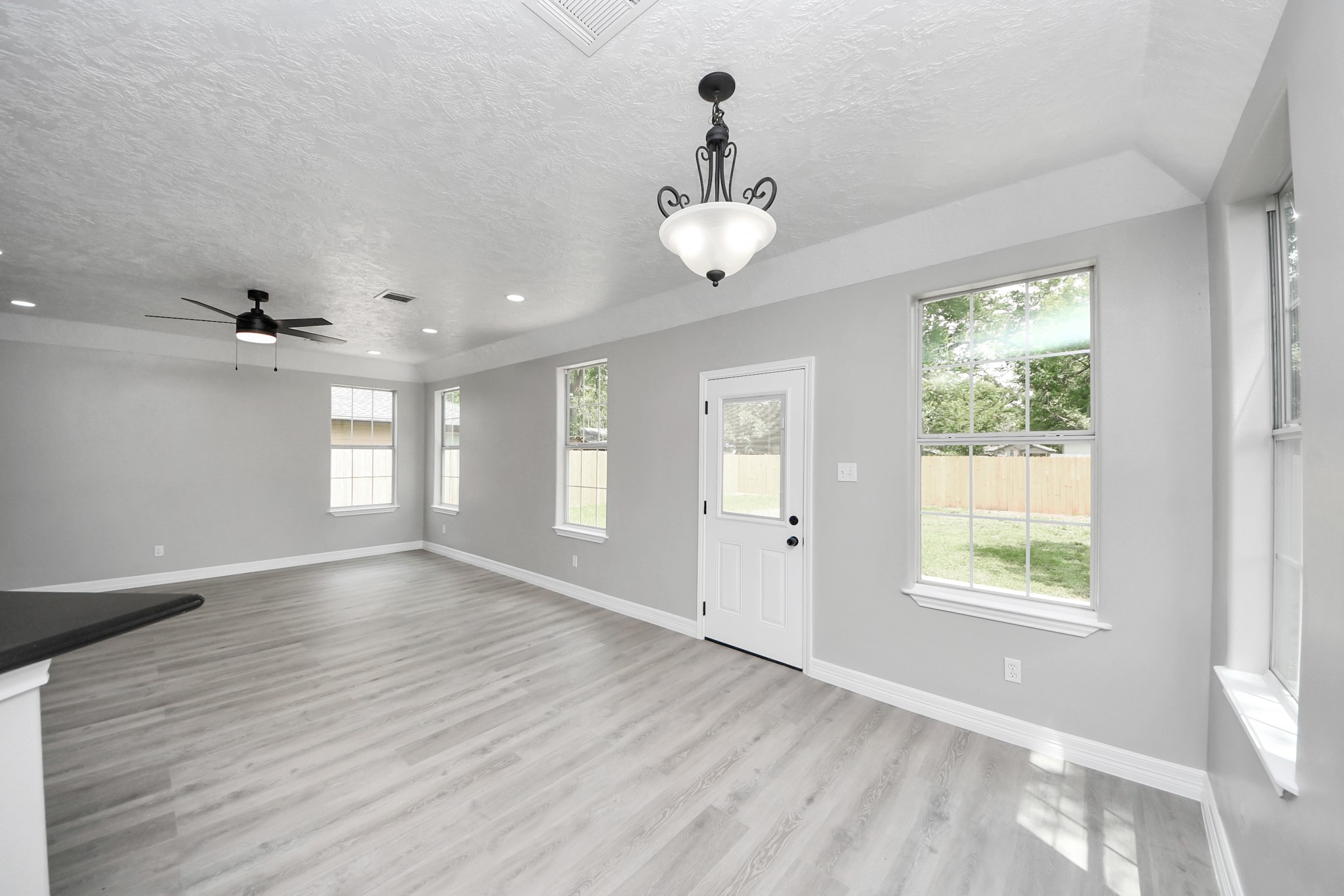 1105 East Kyle Road Clute, TX 77531 - Photo 44 of 44 The spacious open-concept floor plan leaves a great flow from the dining area into the living area and kitchen.