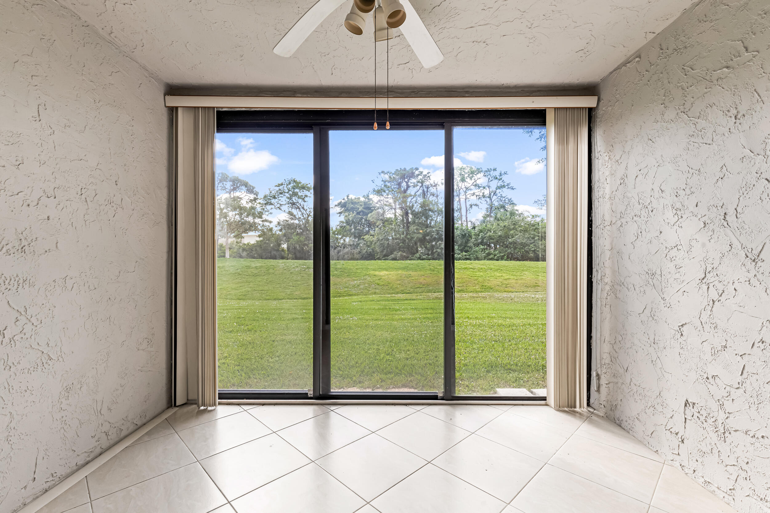 a view of a room that has a large window
