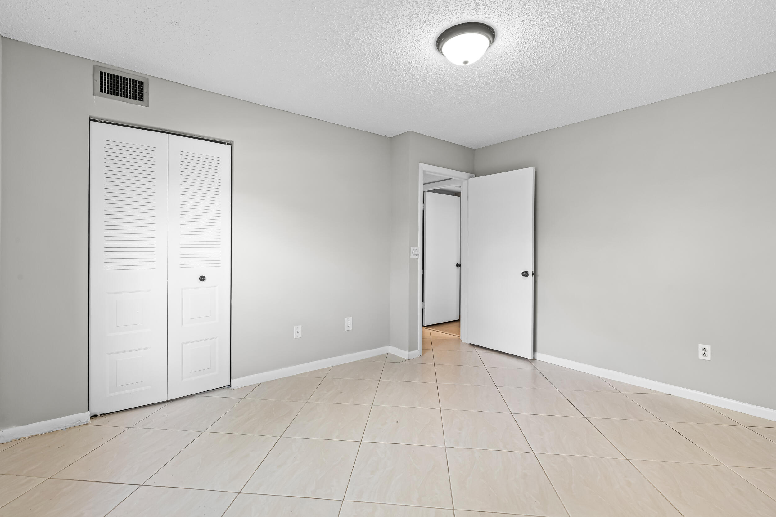 9270 Vista Del Lago, Unit E27 Boca Raton, FL 33428 - Photo 16 of 22 a view of an empty room