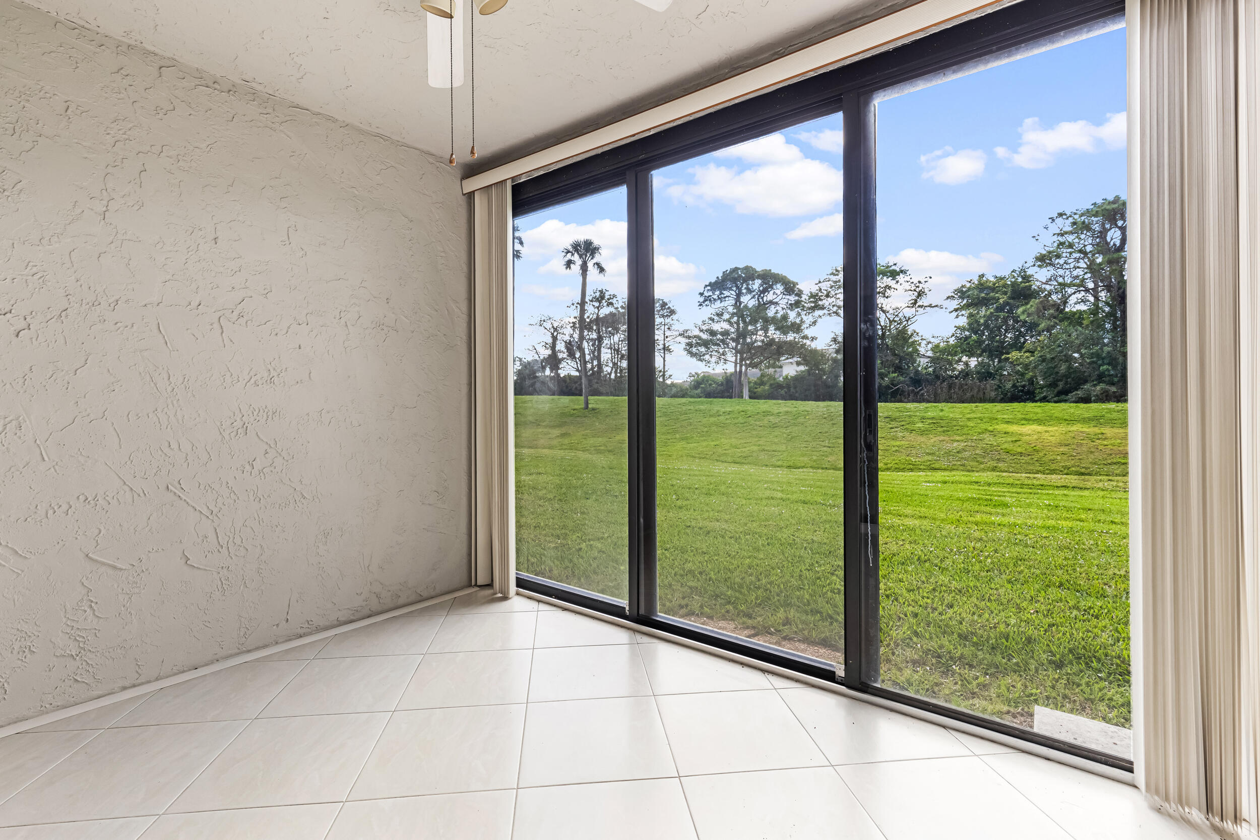 9270 Vista Del Lago, Unit E27 Boca Raton, FL 33428 - Photo 19 of 22 a view of a room with window