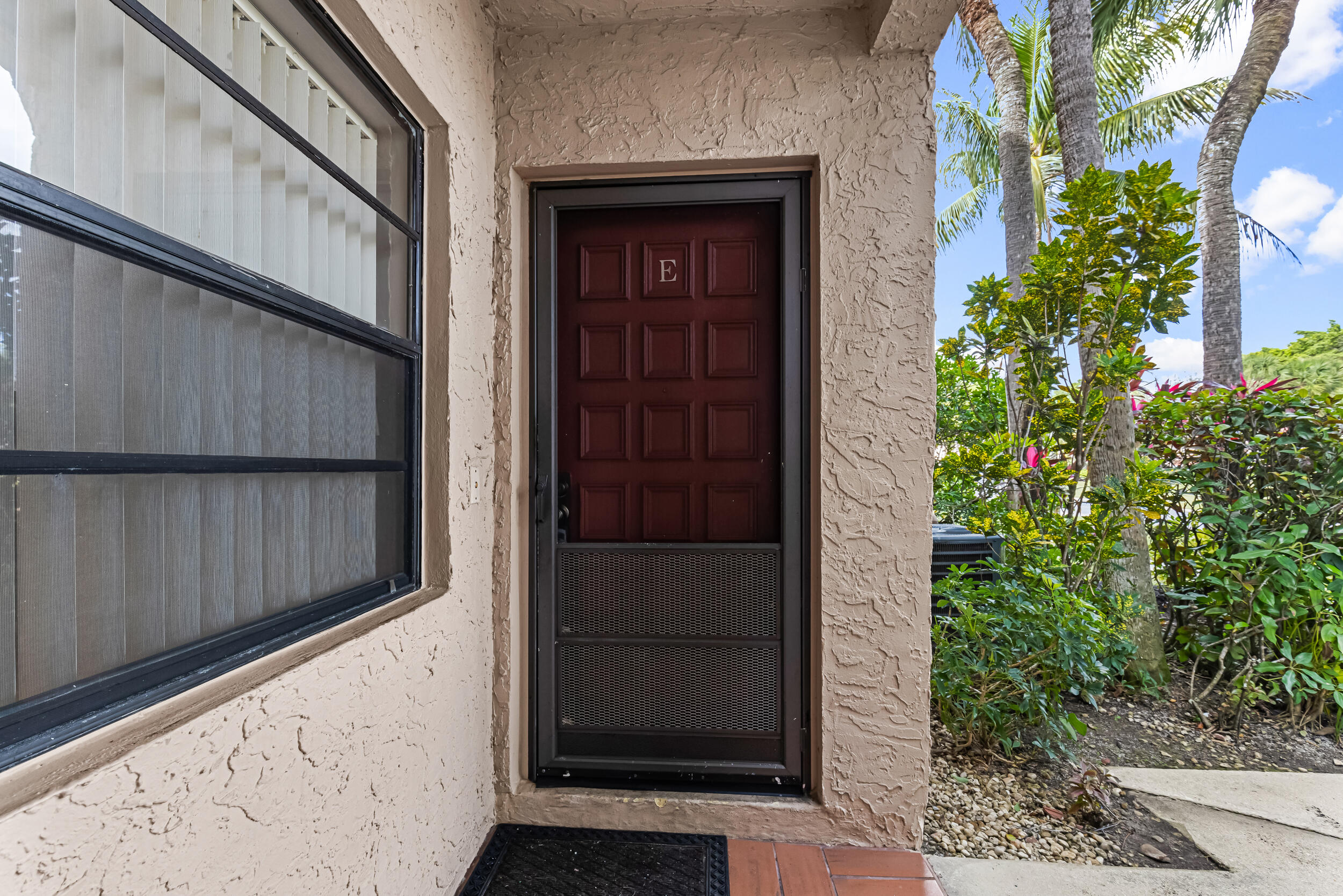 9270 Vista Del Lago, Unit E27 Boca Raton, FL 33428 - Photo 20 of 22 a view of front door