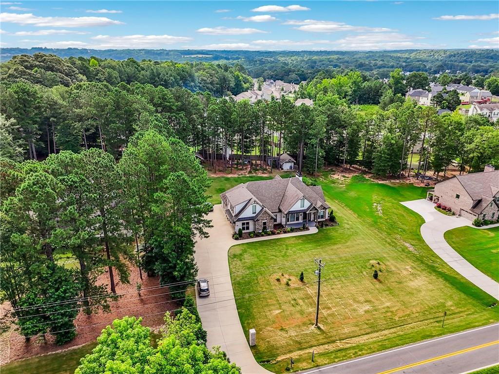 852 Tom Miller Road Bethlehem, GA 30620 - Photo 64 of 68 an aerial view of a swimming pool with a yard
