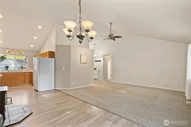 a view of a kitchen with a sink stainless steel appliances and cabinets