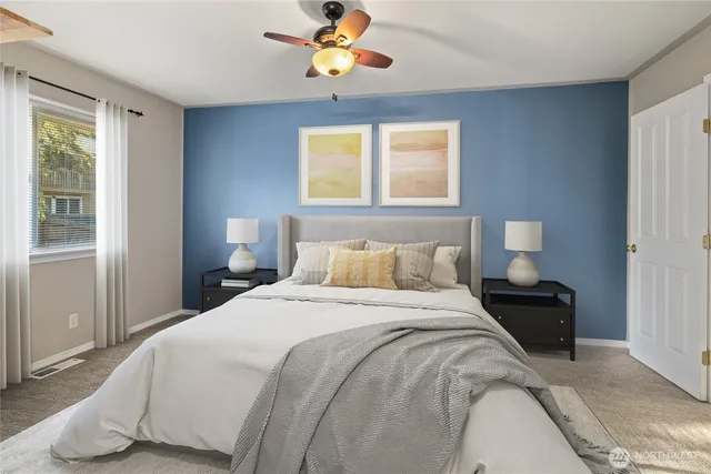 a bedroom with a bed and window