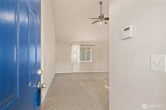 a view of an empty room with a window