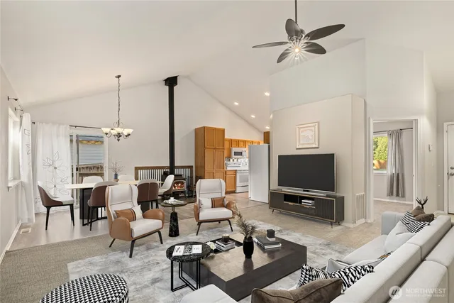 a living room with furniture a rug and a flat screen tv