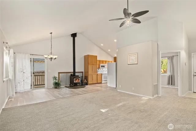 a view of a livingroom with a furniture window and ceiling fan