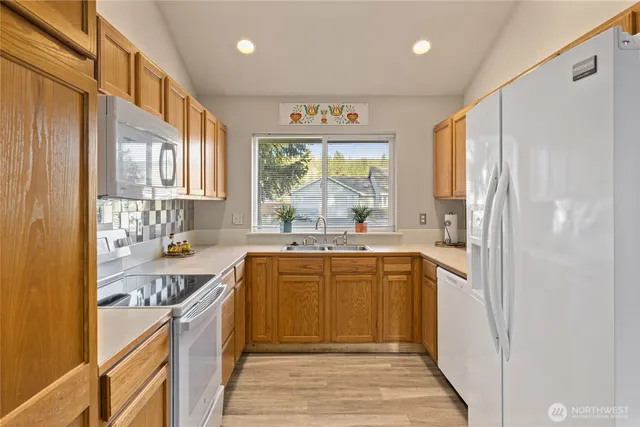 a large kitchen with a large window