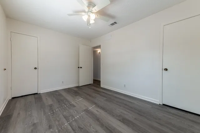 a front view of a house with a yard and a garage