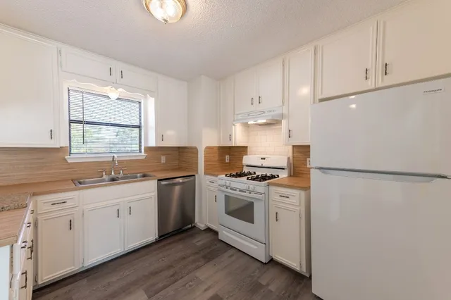 a white toilet and a bathtub