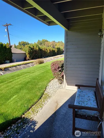 a view of a deck with a big yard