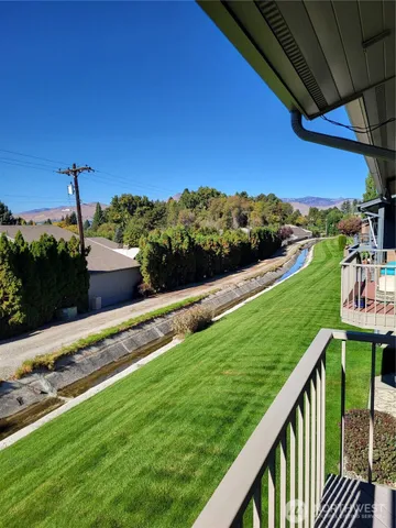 a kitchen with sink a refrigerator and furniture