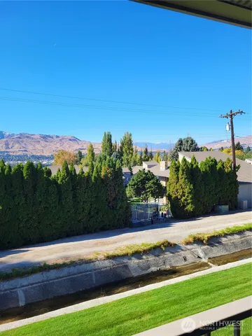 a kitchen with stainless steel appliances a sink and a refrigerator