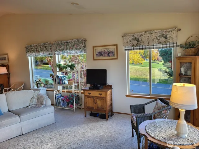 a bedroom with a bed and a dresser in it