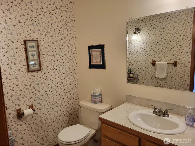 a bedroom with furniture and a large window