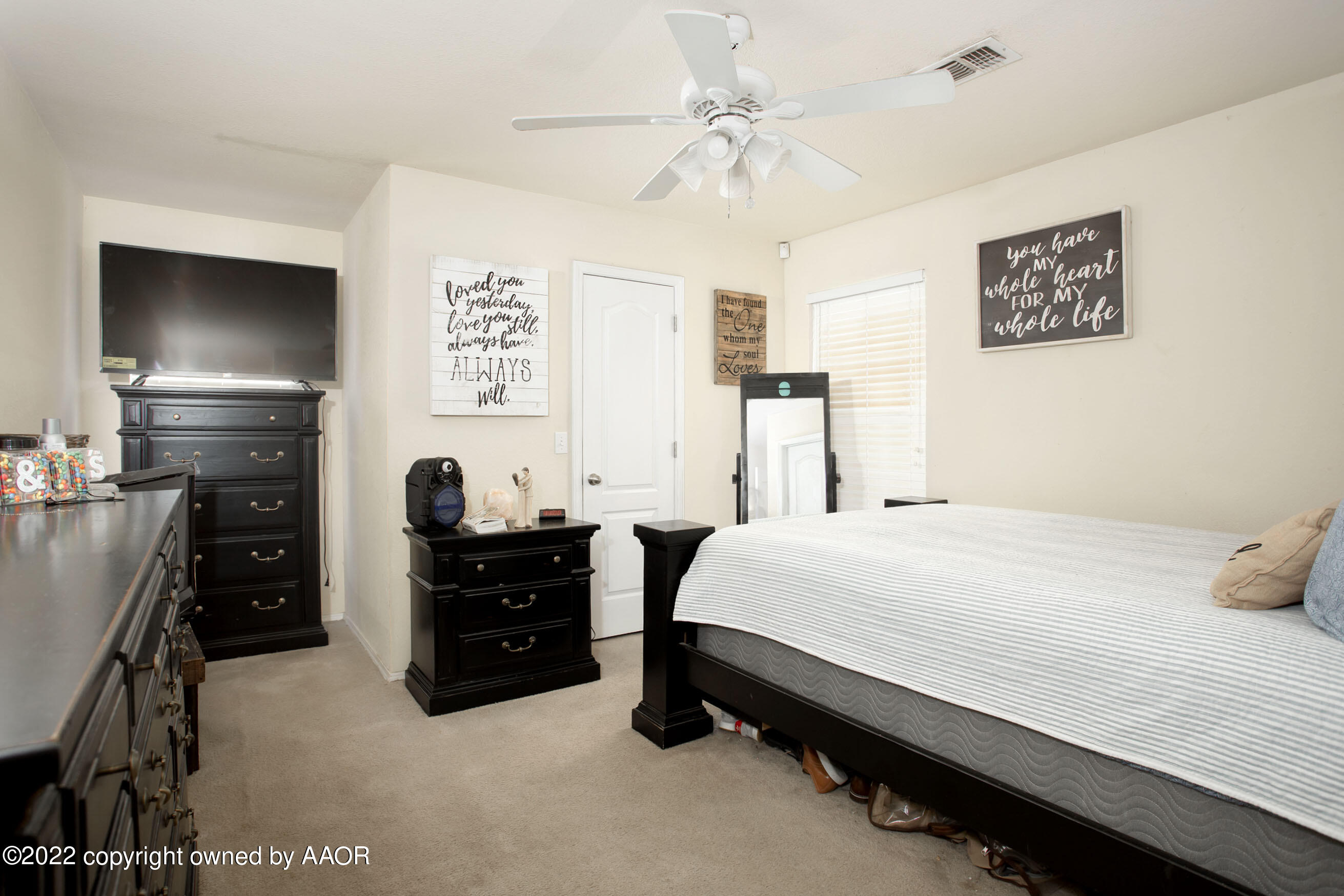 2601 Eagle Point Drive Amarillo, TX 79103 - Photo 11 of 23 a bedroom with a bed and a chandelier