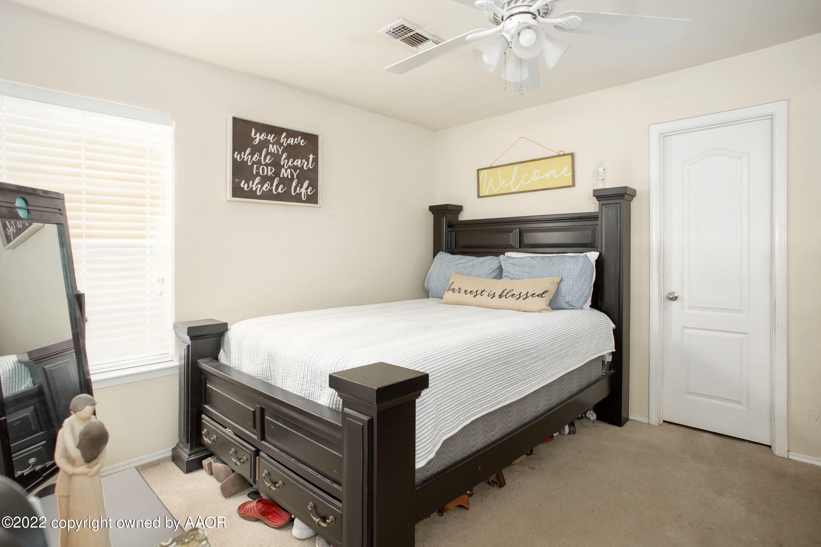 2601 Eagle Point Drive Amarillo, TX 79103 - Photo 12 of 23 a bed sitting in a bedroom next to a window