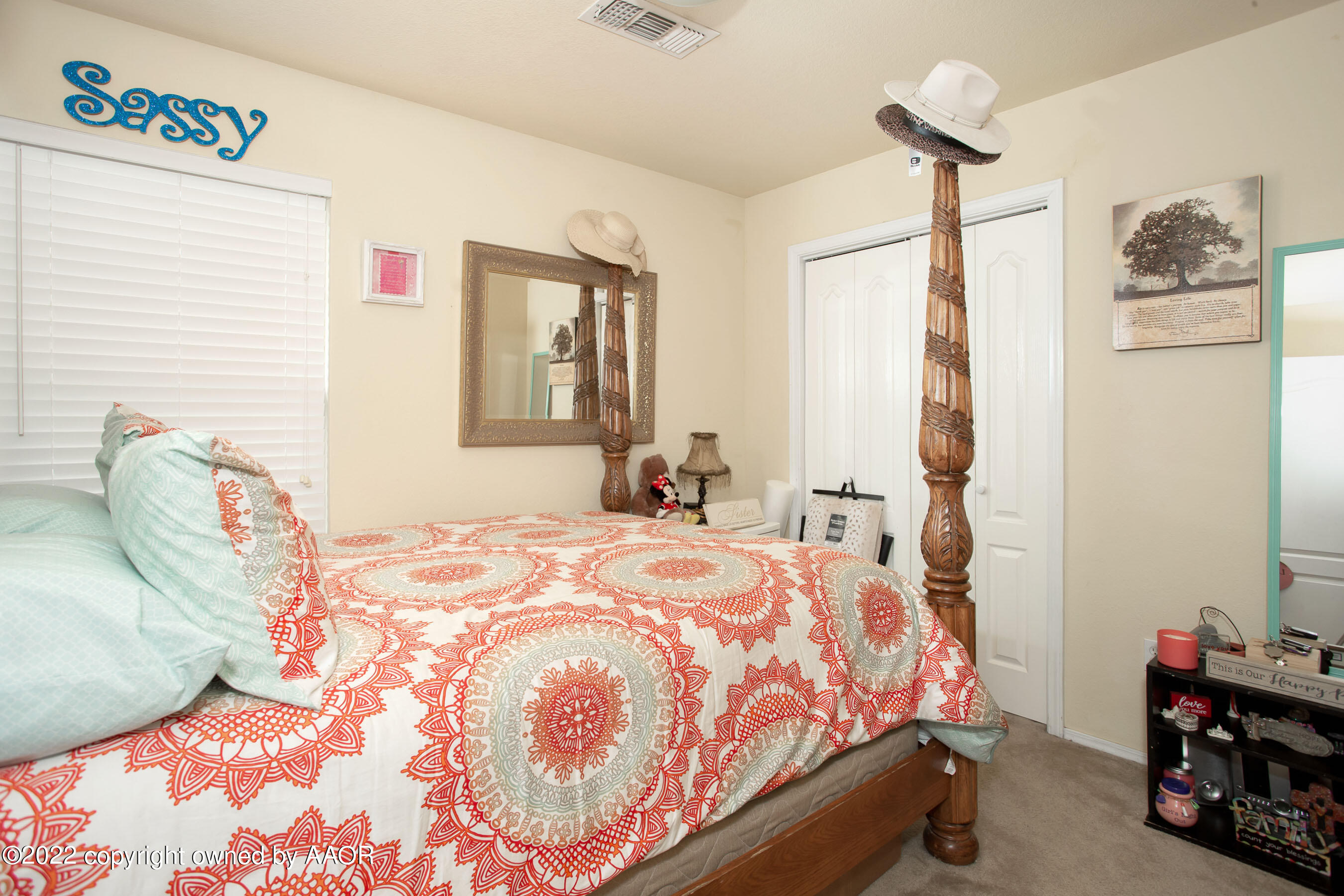 2601 Eagle Point Drive Amarillo, TX 79103 - Photo 14 of 23 a bedroom with a bed a dresser and a chair