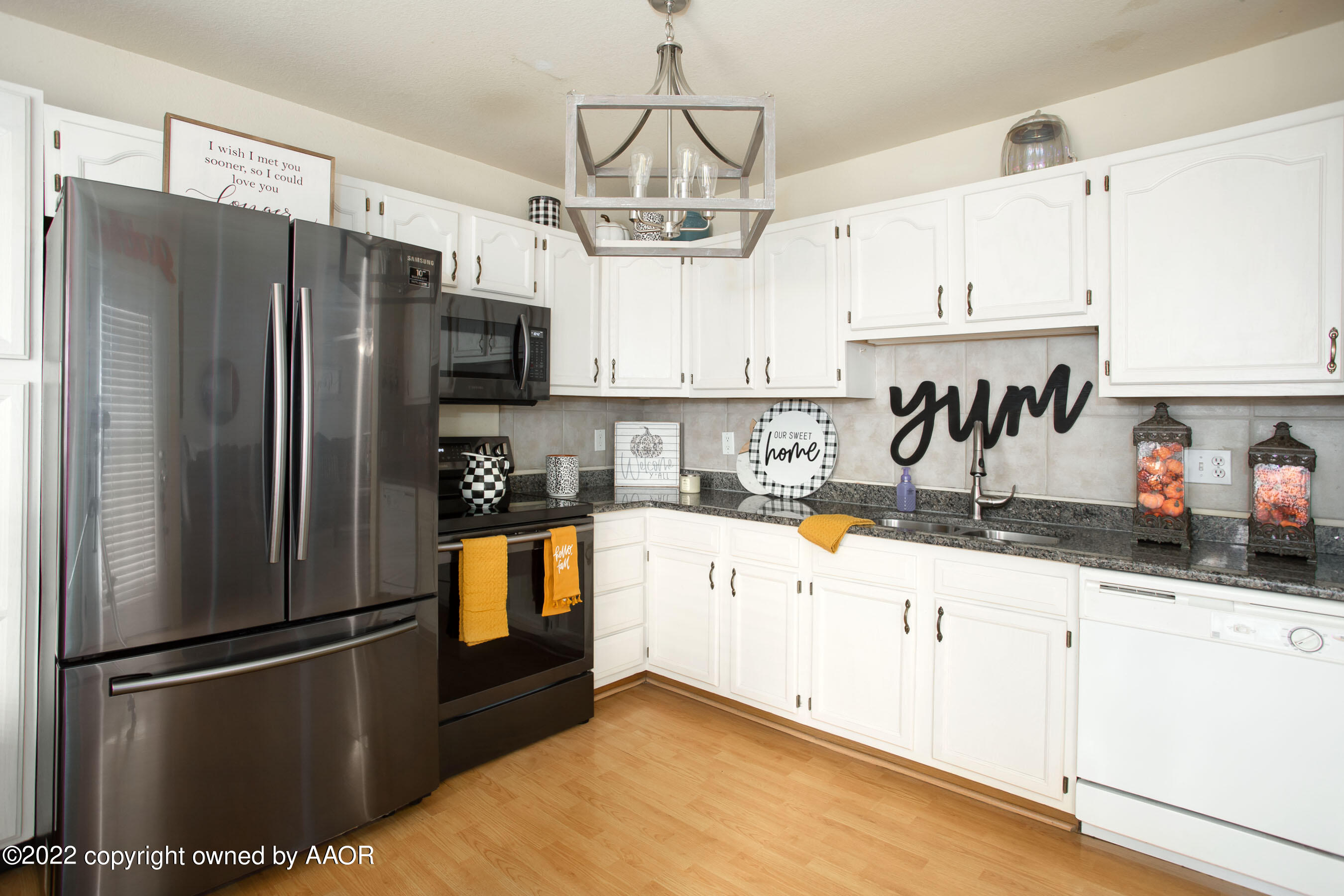 2601 Eagle Point Drive Amarillo, TX 79103 - Photo 5 of 23 a kitchen with granite countertop stainless steel appliances a refrigerator and a sink