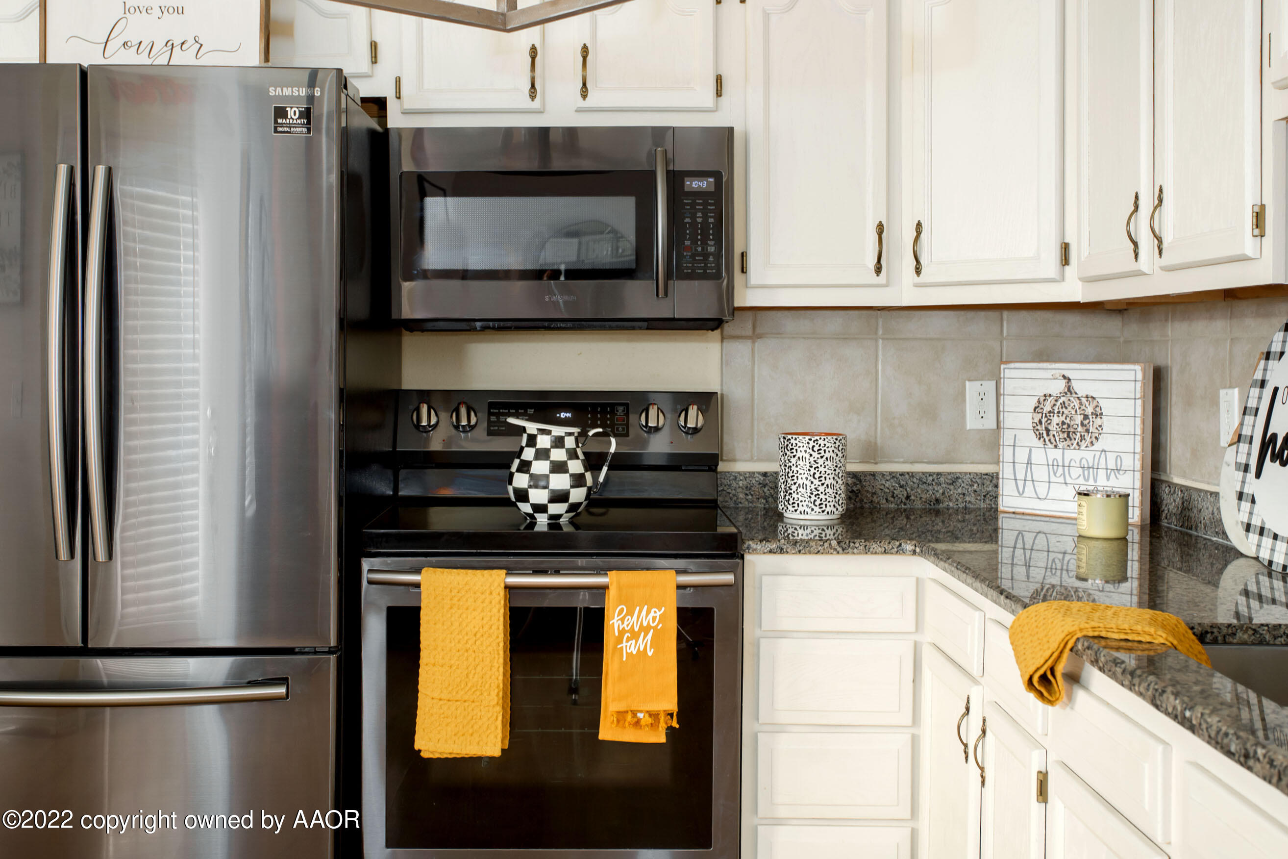 2601 Eagle Point Drive Amarillo, TX 79103 - Photo 6 of 23 a kitchen with stainless steel appliances granite countertop a stove and a microwave