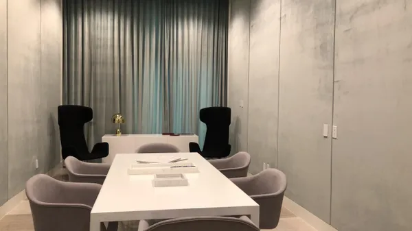 a room with gym equipment and windows