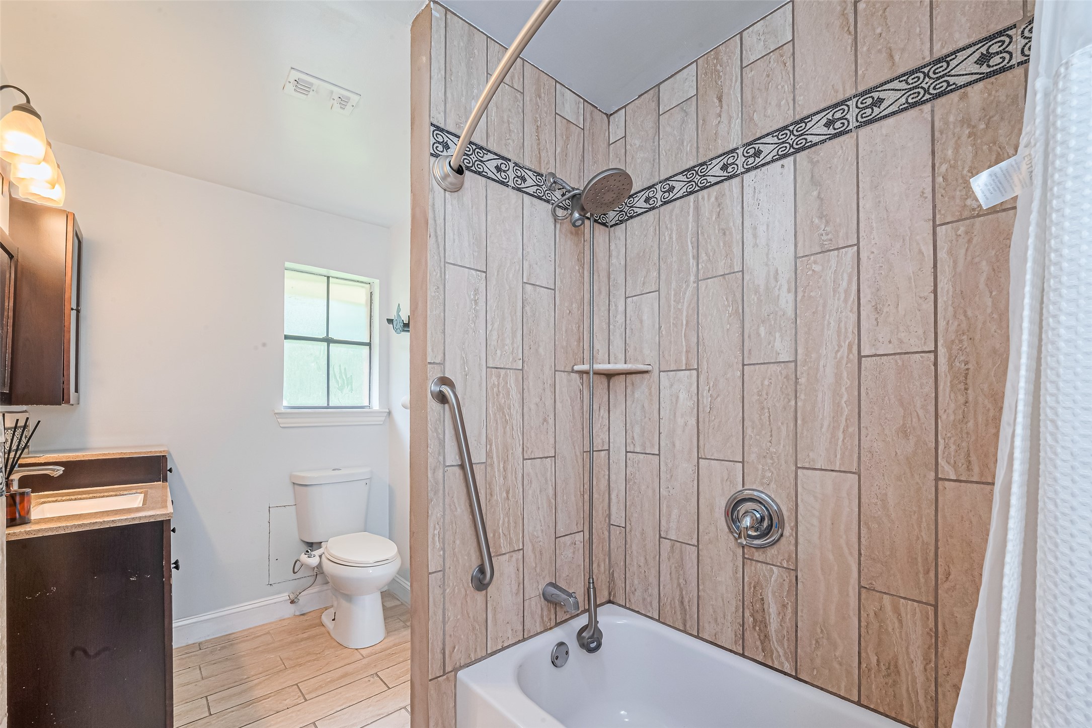 24314 Anderson Street Huffman, TX 77336 - Photo 42 of 48 a bathroom with a sink a toilet and shower