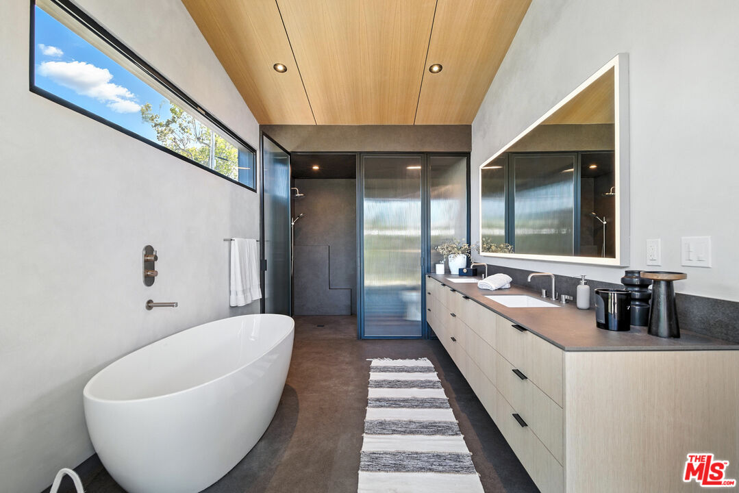 6756 Wandermere Road Malibu, CA 90265 - Photo 13 of 27 a large spacious bathroom with a large tub and sink