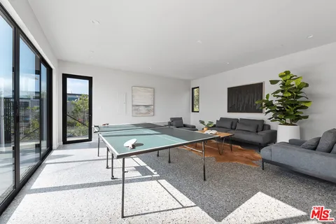a living room with furniture rug and window