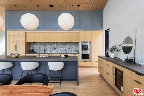 a kitchen with a table and chairs