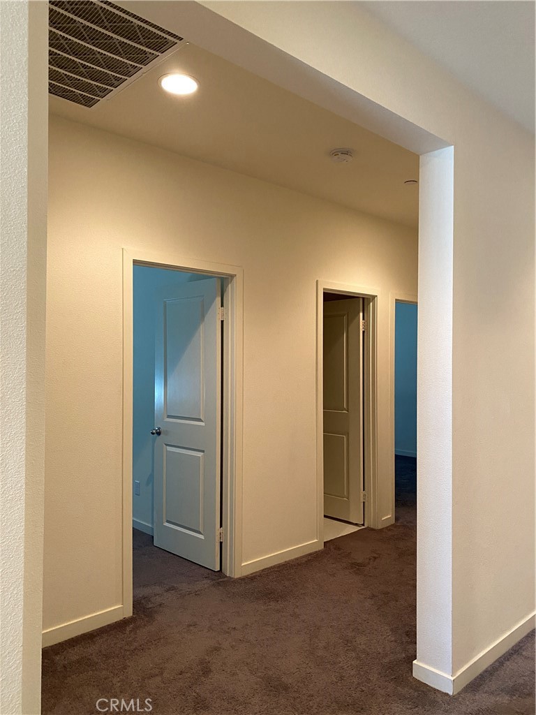 4232 West Ivesbrook Street Lancaster, CA 93536 - Photo 16 of 33 an empty room with closet and wooden door