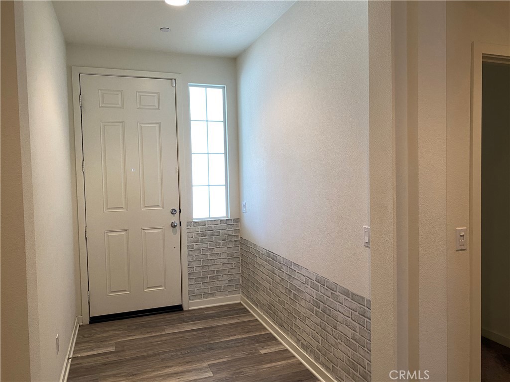 4232 West Ivesbrook Street Lancaster, CA 93536 - Photo 18 of 33 a view of a hallway with wooden floor and closet