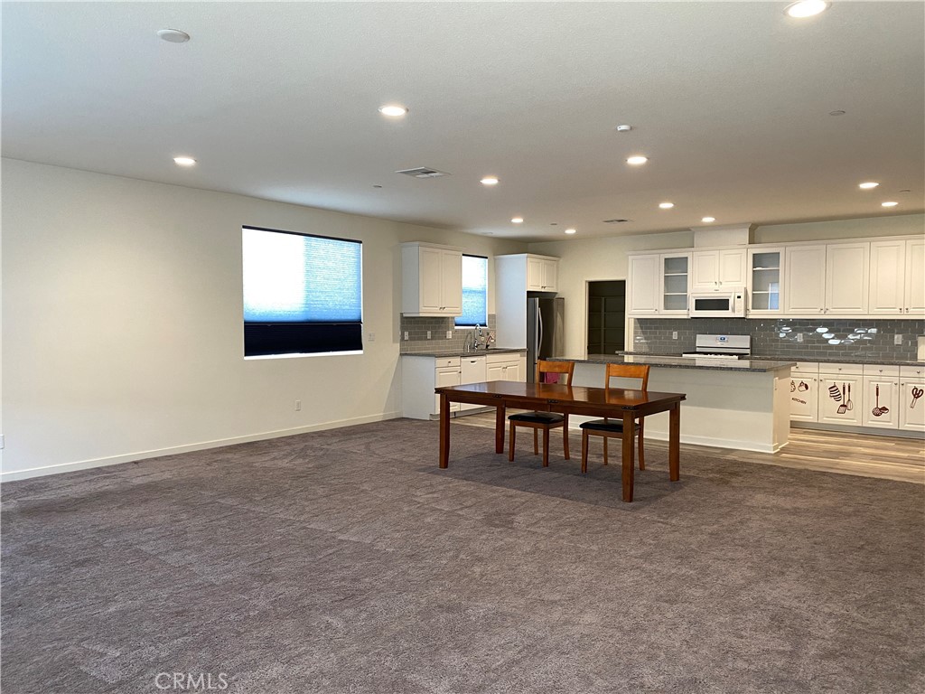 4232 West Ivesbrook Street Lancaster, CA 93536 - Photo 2 of 33 a view of a kitchen and dining room