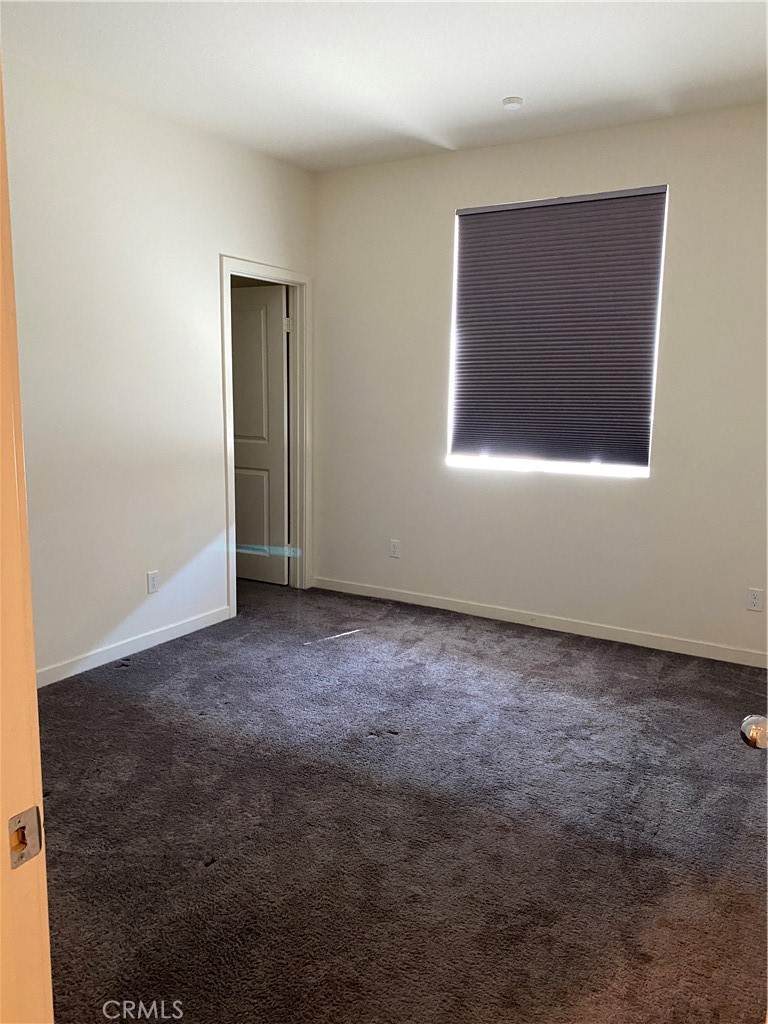 4232 West Ivesbrook Street Lancaster, CA 93536 - Photo 21 of 33 a view of an empty room and window