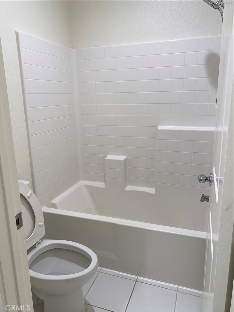 4232 West Ivesbrook Street Lancaster, CA 93536 - Photo 24 of 33 a bathroom with a toilet and a shower