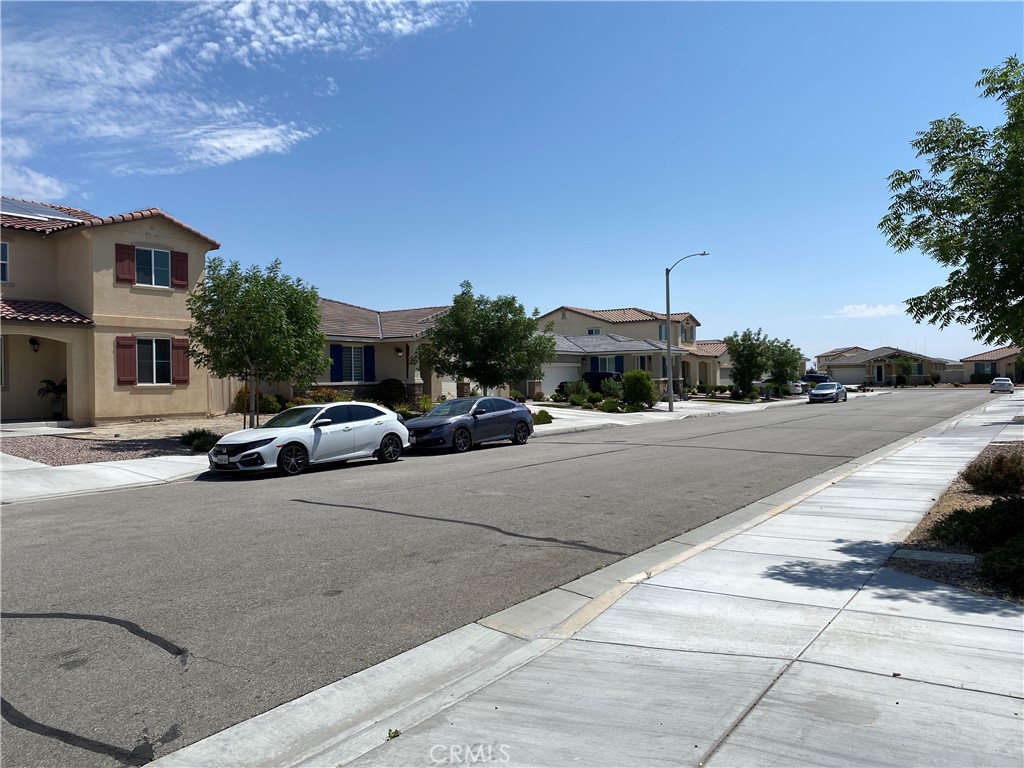 4232 West Ivesbrook Street Lancaster, CA 93536 - Photo 28 of 33 a cars parked on the side of a street