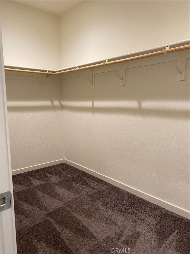 4232 West Ivesbrook Street Lancaster, CA 93536 - Photo 9 of 33 a view of a room with racks on the wall