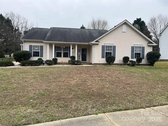 a front view of house with yard outdoor seating and barbeque oven