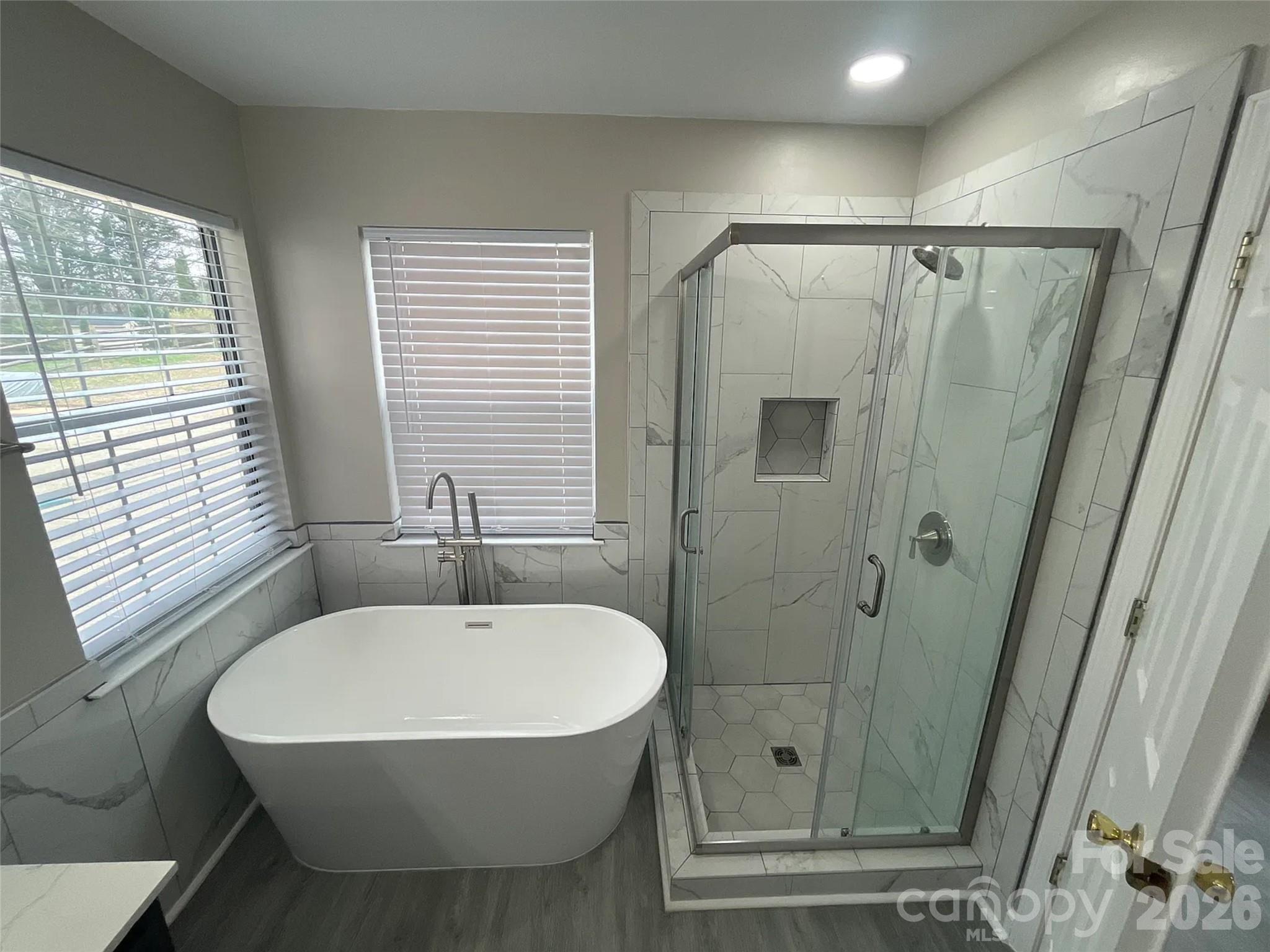 12042 Mallard Ridge Drive Charlotte, NC 28269 - Photo 11 of 20 a bathroom with a sink and shower