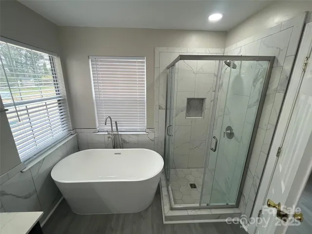 a bathroom with a sink and shower