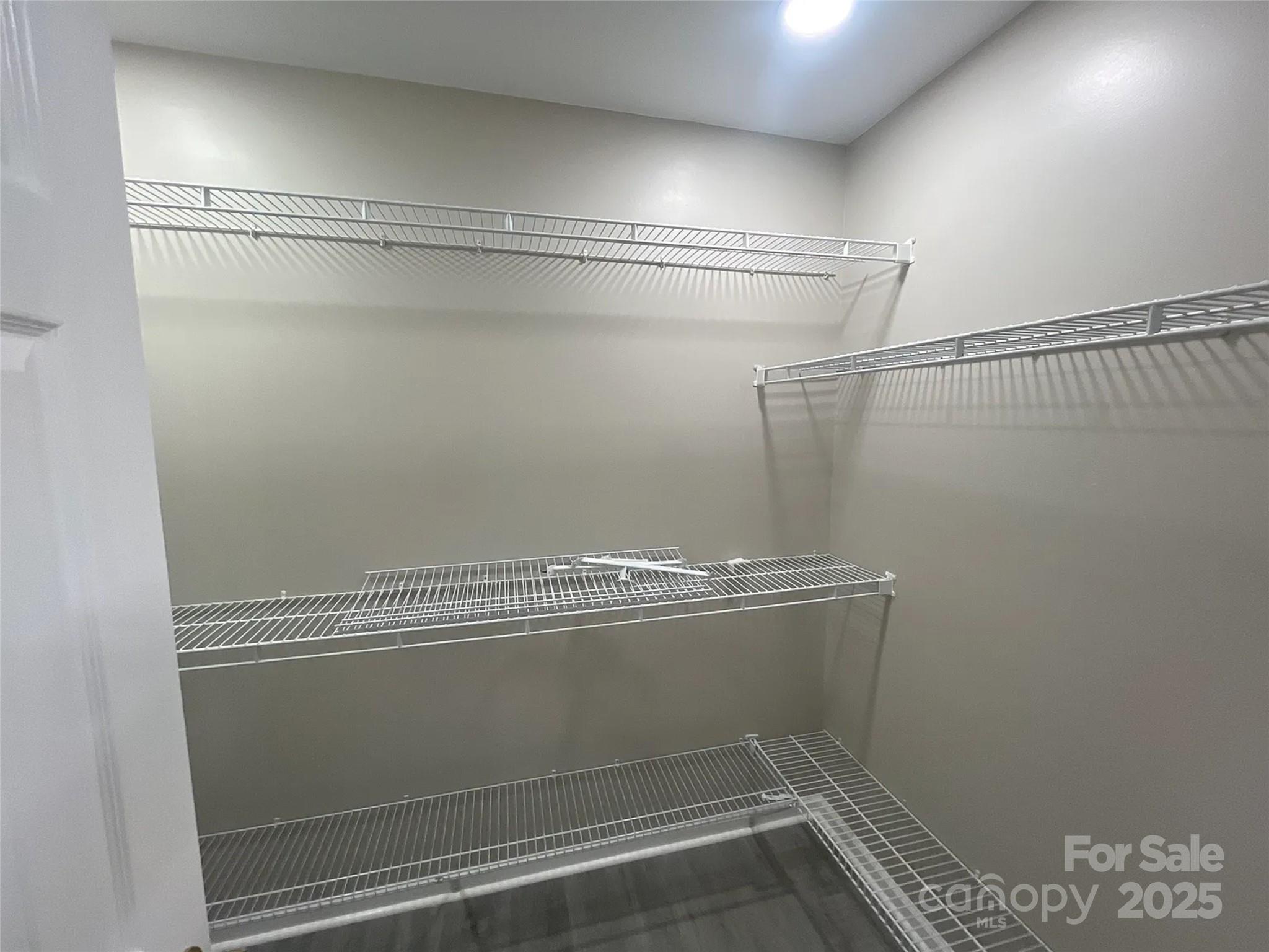 12042 Mallard Ridge Drive Charlotte, NC 28269 - Photo 13 of 19 a view of a room with racks on the wall